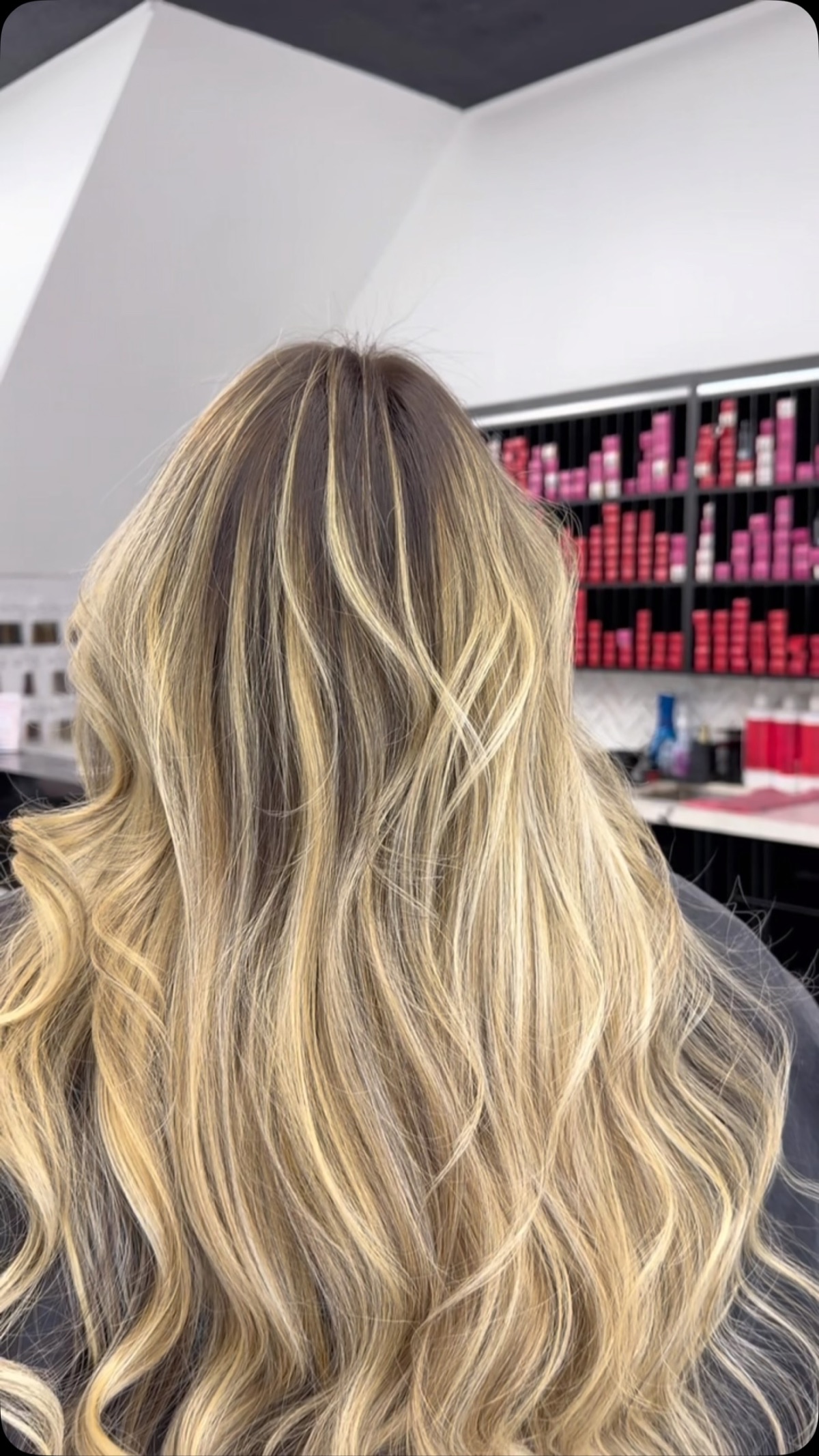 Dimensional blonde balayage with soft waves